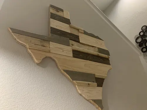 Texas-shaped wall art built from reclaimed pallet boards